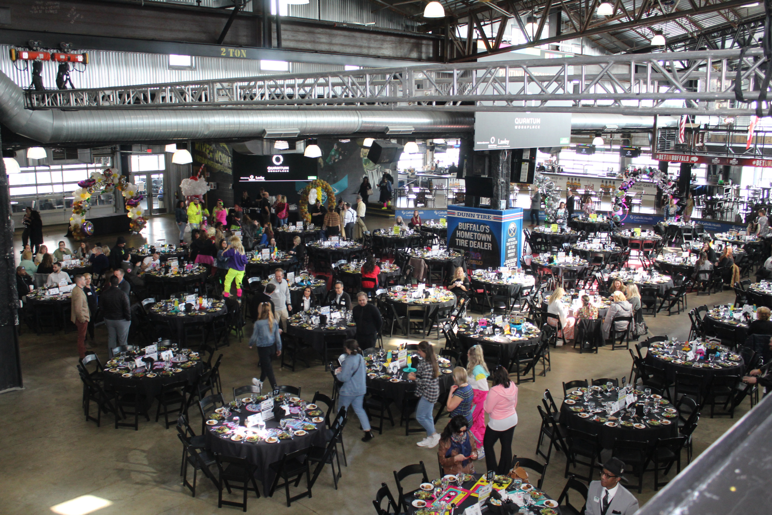 Overhead view of a full facility banquet with the mezzanine above