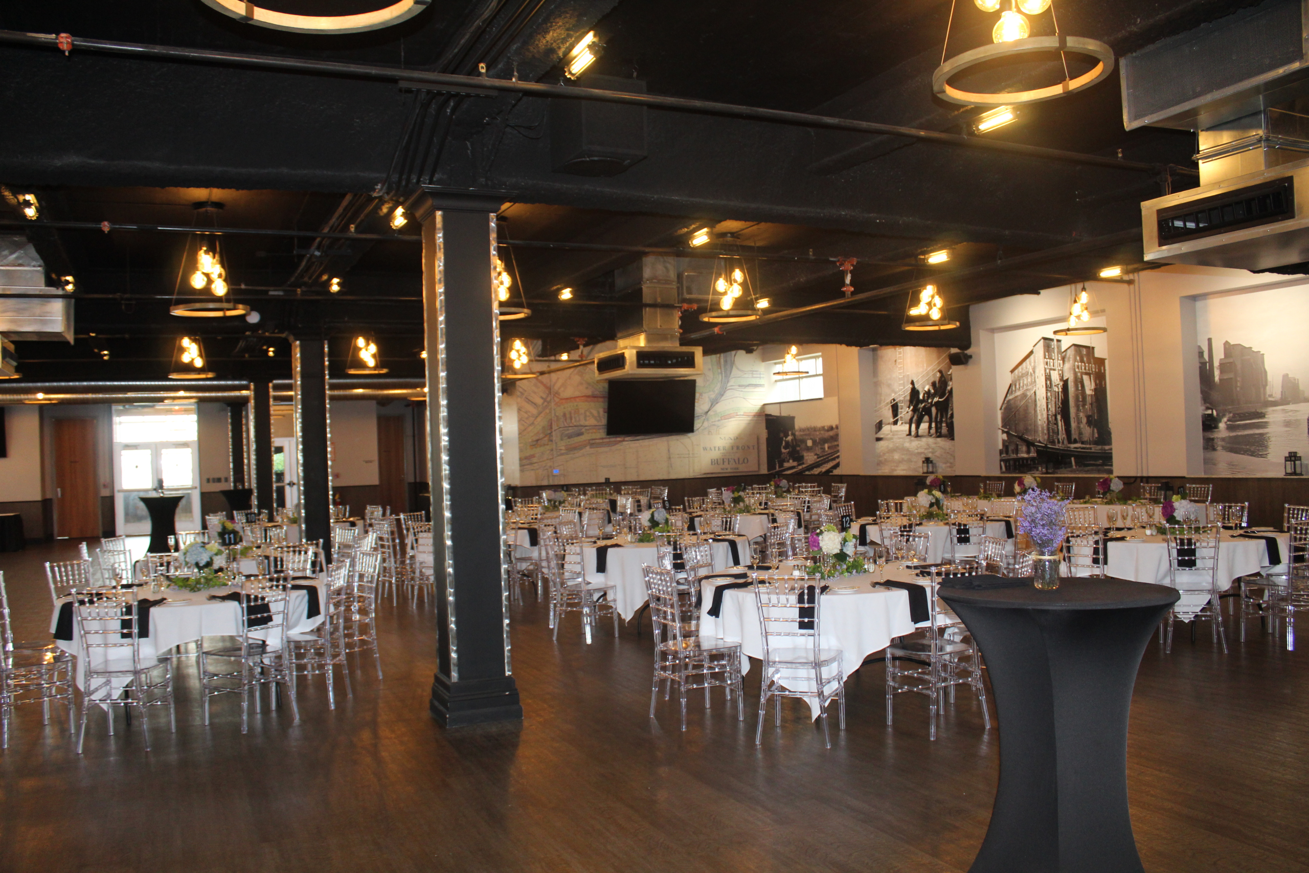 Cocktail tables and set rounds across the Silos Event Center before guests arrive