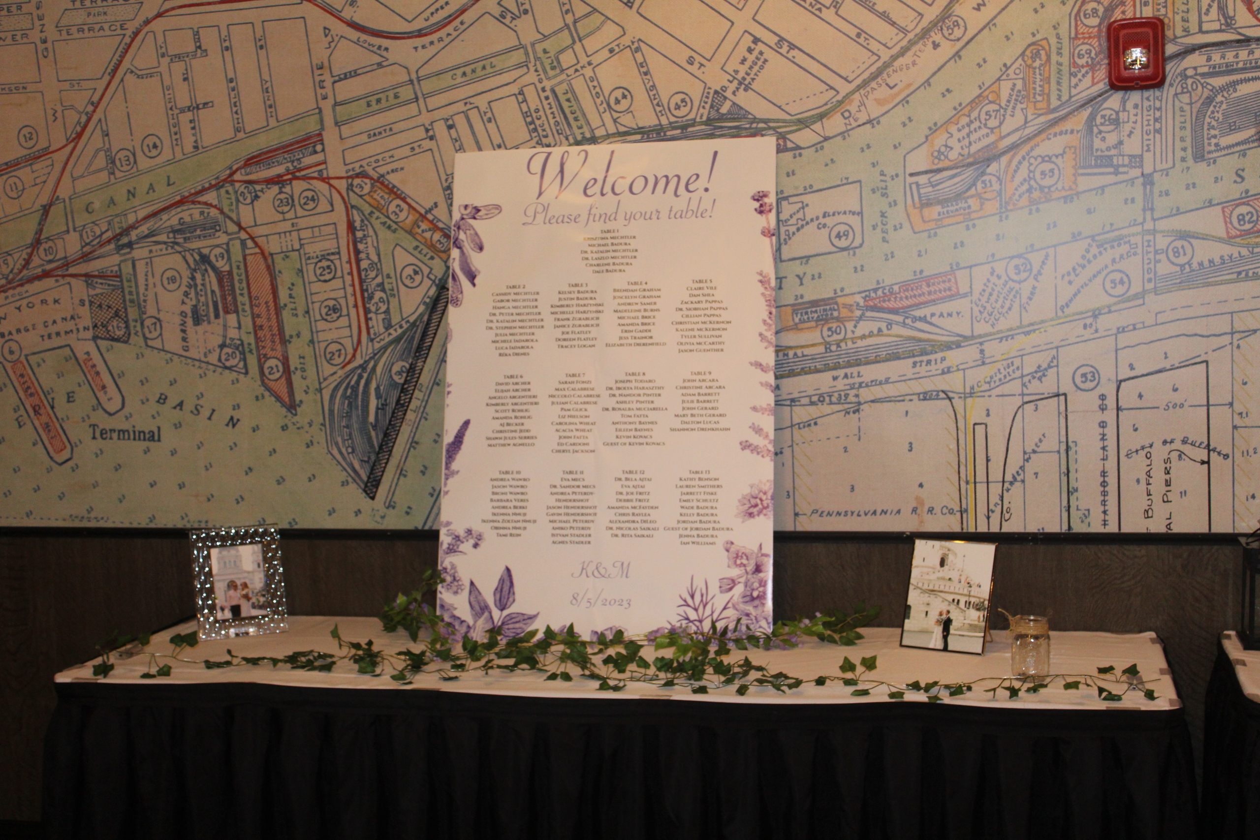 Seating chart board and place cards on the welcome table