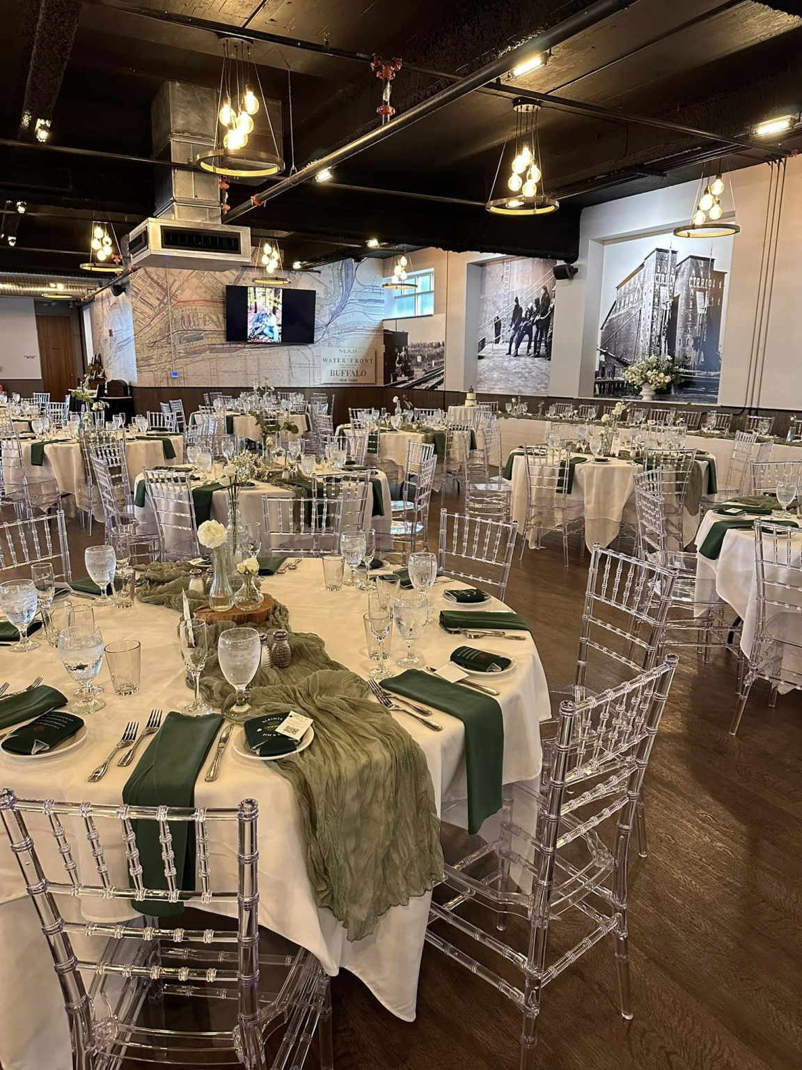 Place settings and folded napkins running down a dressed banquet table