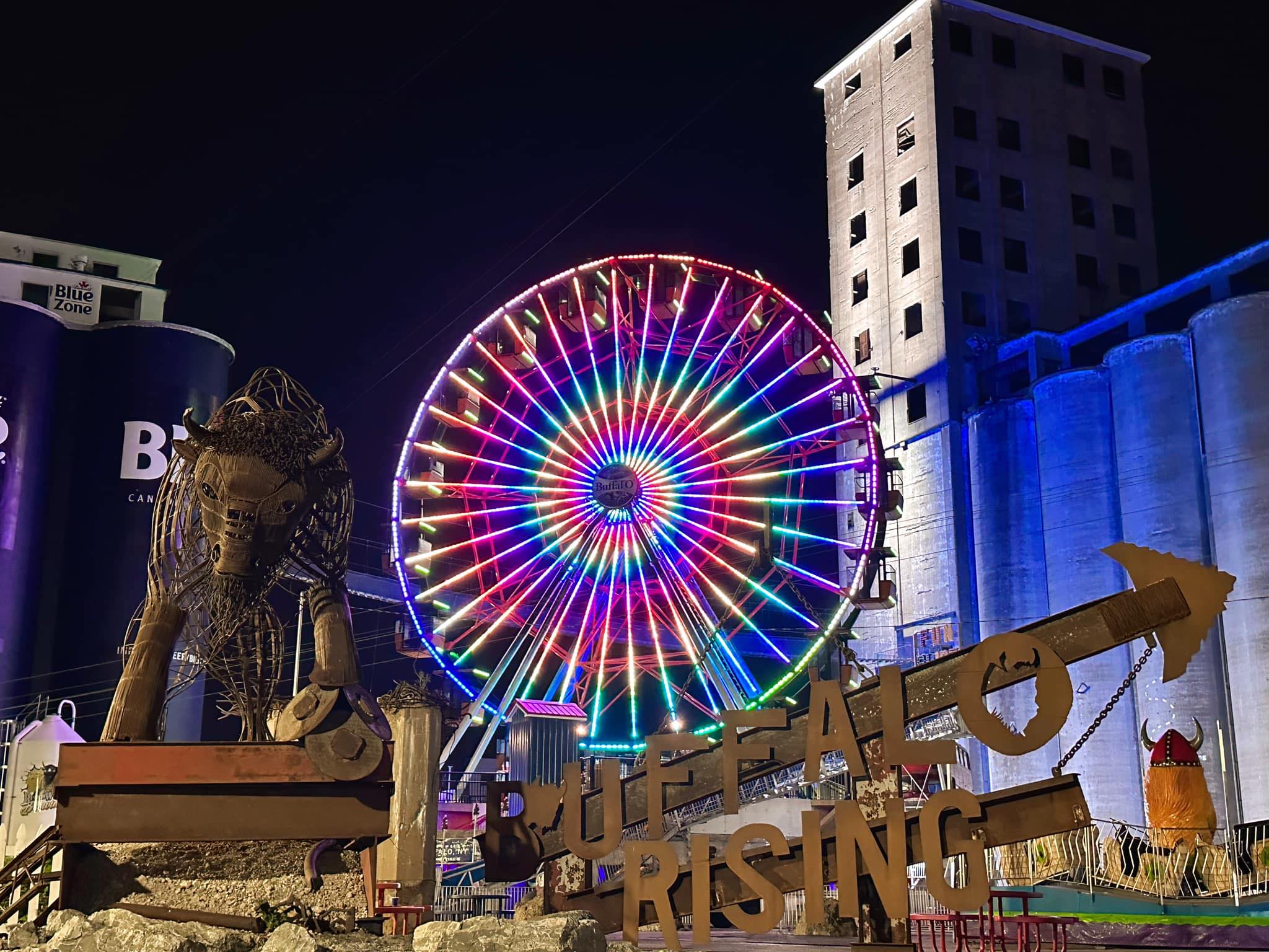 The Buffal-O ferris wheel lit up at night