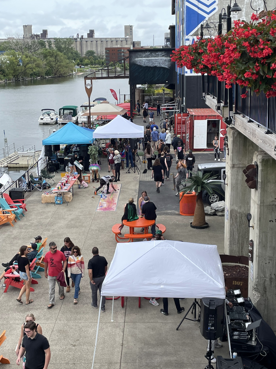 Vendor tents set up along the waterfront outside RiverWorks