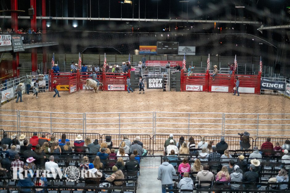 A seated crowd watching an event in the RiverWorks arena