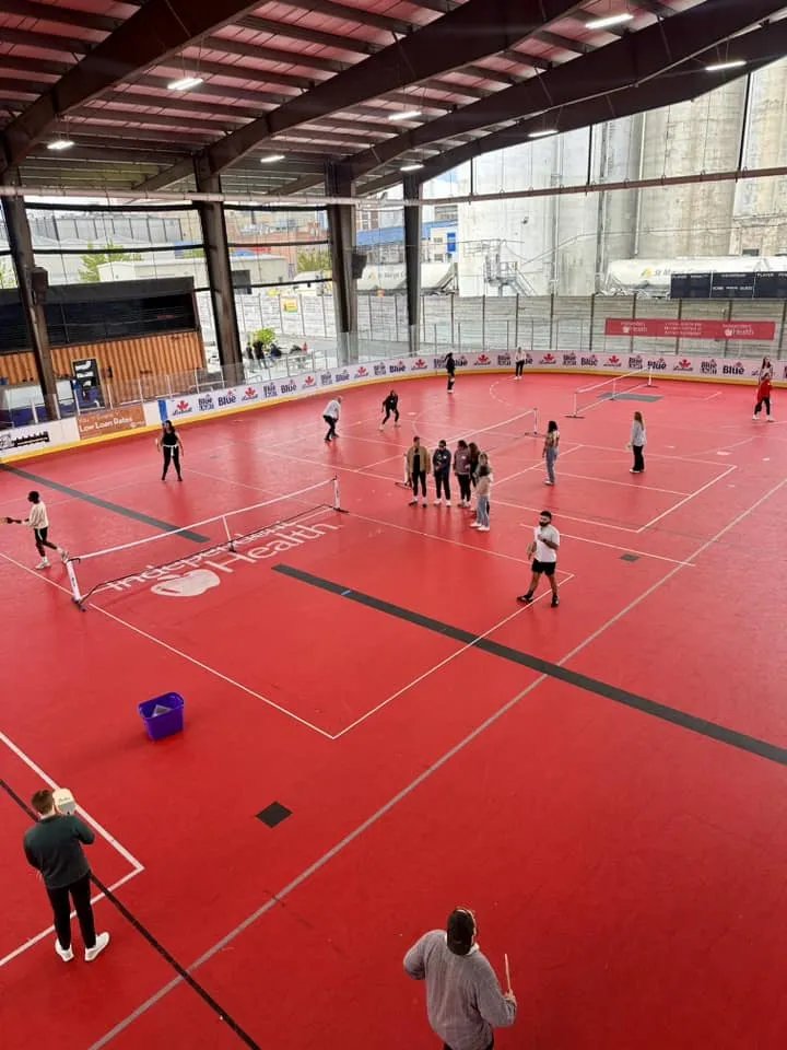 Players on the indoor court at RiverWorks