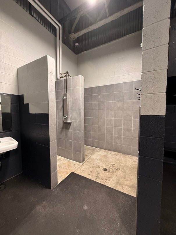 Locker room shower stall.